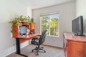 Office area featuring light colored carpet