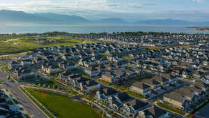 Birds eye view of property with a water and mountain view