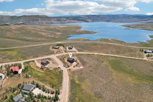 Drone / aerial view with a water and mountain view