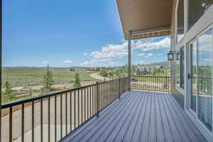 Wooden deck featuring a rural view