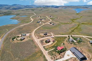 Bird's eye view with a rural view and a water and mountain view