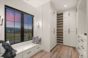 This master closet is truly stunning.  Featuring plenty of hanging cabinetry, as well as, drawers.