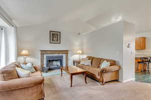 Living Room has newer carpet and a functioning wood burning fireplace!