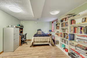 2nd basement bedroom with 2 closets and laminate flooring