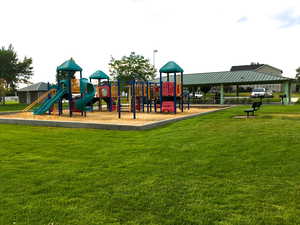 Neighborhood park has tennis courts, soccer fields, basketball hoops, sand volleyball and net, pavilion with tables, restrooms, and a cute playground. **Dogs are allowed on leash**