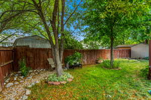 Backyard with mature trees for shade!