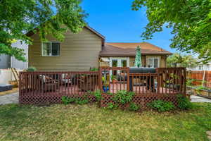 Oversized back deck shaded by mature trees!