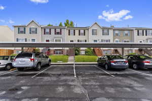 View of vehicle parking featuring a carport