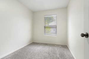 Unfurnished room with carpet floors