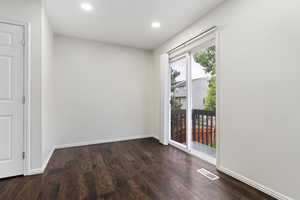 Spare room with hardwood / wood-style floors