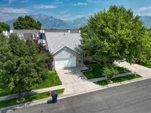 View of front of home featuring a mountain view and a garage