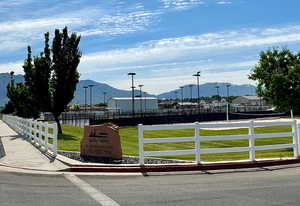 View of front of home with a front lawn and a mountain view