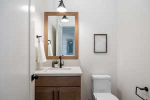 Bathroom with vanity and toilet