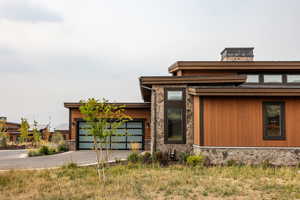 View of front facade featuring a garage