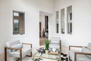 Sitting room with light colored carpet