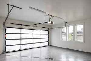 Garage featuring a garage door opener