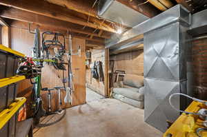 Basement featuring brick wall and a workshop area