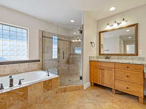 Spa-Like Bathroom featuring separate Euro shower and jetted tub