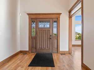 Foyer with hardwood flooring