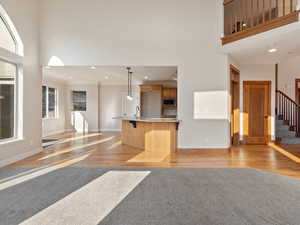 Kitchen featuring stainless steel microwave, hardwood flooring, breakfast nook