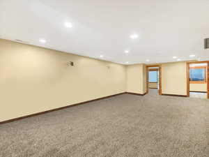 Finished basement featuring recessed lighting and carpet floors