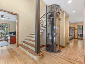 Elevator and custom stairway