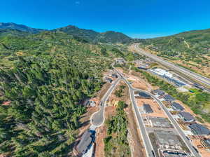 Birds eye view of property with a mountain view