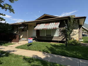 View of front of home featuring a front lawn