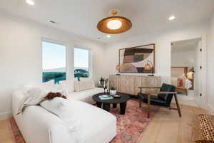 Living room featuring views of mountains and Utah lake