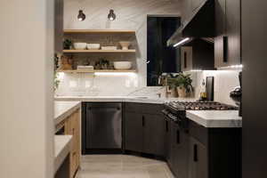 Kitchen featuring light tile patterned flooring, wall chimney exhaust hood, and decorative backsplash