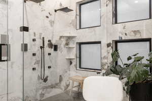 Master Bathroom with tile walls and tiled shower