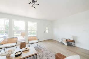 Living room with light hardwood / wood-style floors