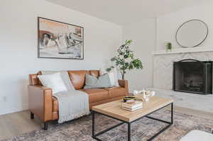 Living room with hardwood / wood-style flooring