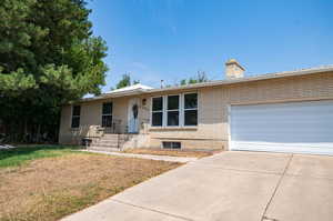 View of front of home featuring a garage