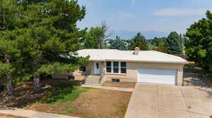 Ranch-style home featuring a garage