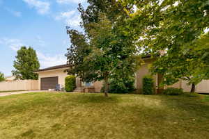 View of yard with a garage