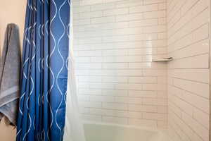 Bathroom featuring shower / tub combo