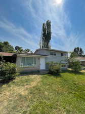 View of front of home featuring a front lawn