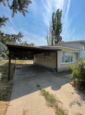 View of front of property featuring a carport