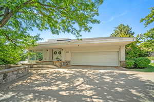 View of front of home featuring a garage