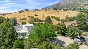 Birds eye view of property with a mountain view