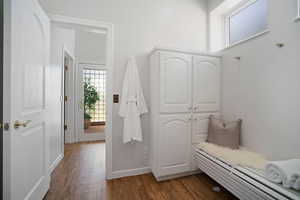 Mudroom with dark hardwood / wood-style floors