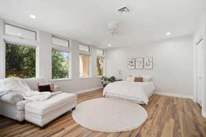 Bedroom featuring hardwood / wood-style floors and ceiling fan