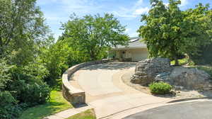 Obstructed view of property with a garage