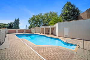 View of swimming pool featuring a patio area