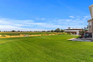 View of yard with a rural view