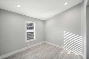 Unfurnished room with light hardwood / wood-style floors