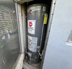 Utility room with gas water heater