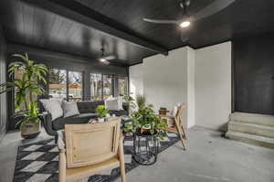 View of patio with ceiling fan and outdoor lounge area