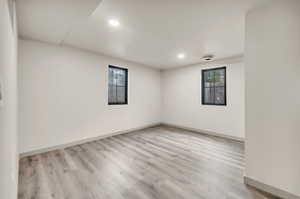 Spare room featuring light wood-type flooring